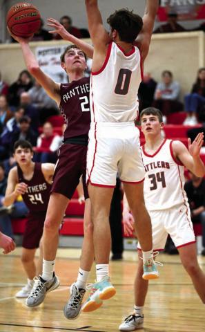 Timber Lake senior Kyler Bollinger puts a shot over the outstretched arms of a Potter County defender during the Panthers’ matchup with Potter County last Friday, Feb. 23. Bollinger finished the contest with five points. Timber Lake tipped off the Region 8B Boys Basketball Tournament on Tuesday facing Takini in the first round. Photo by Marie Du Preez