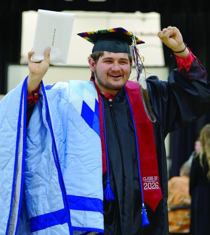 Timber Lake High School graduate Jesse Ridl celebrates after receiving his diploma at commencement exercises held Saturday, May 9. He is the son of Jackie Ridl and Ted Smolik. Photo by Marie DuPreez