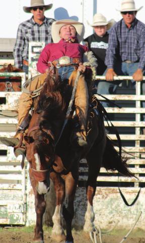 Cinch Hebb of Dupree comes out of the gate for his ranch bronc ride in McLaughlin.