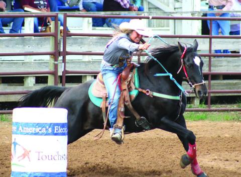 (Left) Charly Etzkorn of Dupree leads her horse around a barrel during the SDHSRA’s Northwest Region Rodeo in Dupree. Etzkorn missed the cut to qualify for state in barrels, but advances to compete in girls cutting, team roping and goat tying. Photos by Jon Flatland