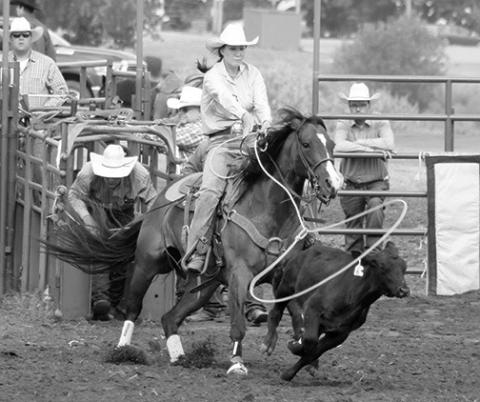 Sloan Anderson of White Horse came out of the gate firing during the ladies breakaway competition at the Days of 1910 Rodeo. Unfortunately for Anderson, her rope missed its mark and she took a no-time to end her day. Photo by Jon Flatland
