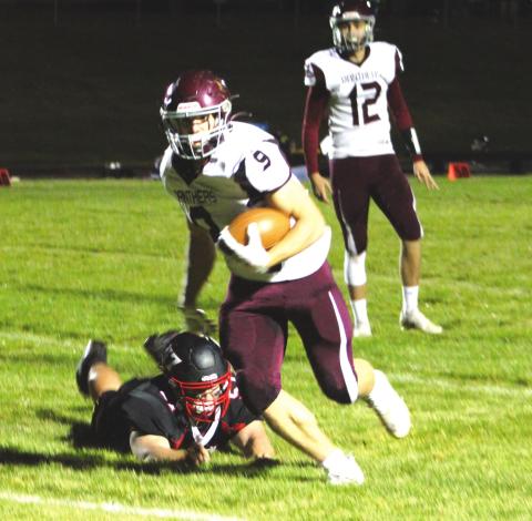 Senior running back Hank Kraft (9) made the game-winning catch on a pass from senior QB Kedrick Martin (12) to lift the Panthers over Lyman in the 9-man football playoffs. Photo by Ryan Deal