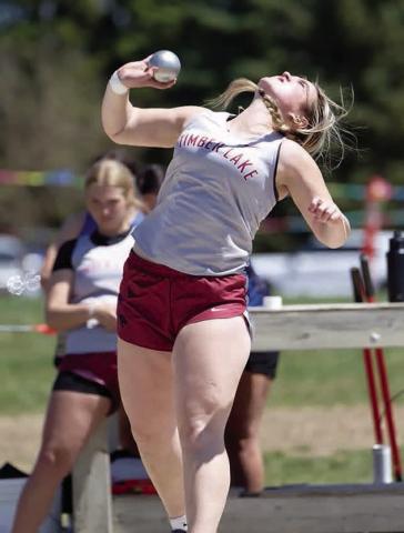 Katelyn Biegler reaches for power during the shot put competition at the Timber Lake Classic last week. She took top honors with a mark of 91 feet and 8 inches. Photo by Marie DuPreez