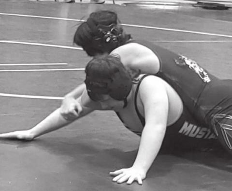 Brady Maher (bottom) wrestles for the Mclaughlin/Timber Lake Mustangs.