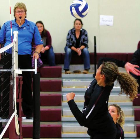 Jasmine Nash makes a spike in varsity volleyball action for the Panthers. Photo by Jon Flatland