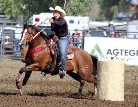 Photo by Jon Flatland Hope Kiel of Glenham, shown here competing in barrel racing, set a new arena record in the ladies breakaway roping event at the South Dakota 4-H State Finals Rodeo last weekend in Aberdeen, posting a blazing 1.5 second run.