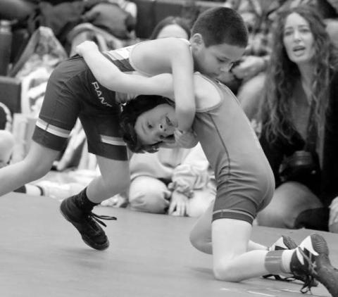 Timber Lake’s Wilson Wiedmer (left) locks up with Pate Chanley of Jones Co. in the boys 8U 57 pound bracket at the SDWCA Distrit 3 Wrestling Tournament held in Timber Lake on Saturday, March 8. Chanley went on to win an 18-7 Major Decision.