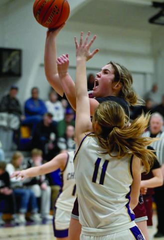 A determined Kate Biegler of Timber Lake takes the ball to the hoop while being defended by Sully Buttes guard Annaliese Van Zee during recent Lady Panthers girls basketball action. Photo by Marie DuPreez