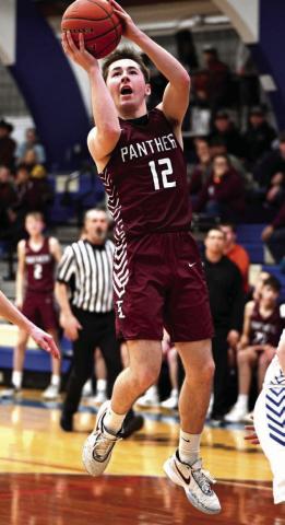 Junior Cole Ducheneaux puts up a running jumper against Lemmon in the Region 8B Tournament. Photo by Marie Du Preez