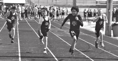 Dupree runners (L-R) Max Dupris, Hudson Terveen, Marty Marshall and Garrick Dekle sprint down the track in the 100 meter dash event of the Bowman junior high track meet held April 11.