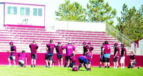 Head Coach Ryan Gimbel leads the Timber Lake Panthers through an offensive drill during practice at Doug Kraft Field on Monday. The Panthers will open their 2022 football season on Friday, Aug. 19, facing Lemmon-McIntosh in Lemmon. Photo by Jon Flatland