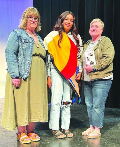 Kessa Bigger (MIDDLE) was the recipient of the $500 Beau DuBray Memorial Scholarship, presented by Principal Julie Marshall (left) and Native American Education Coordinator Amy Sandquist (right) on behalf of Beau’s family. The award honors a senior who is kind and supportive of others, always the first to offer help, and who is in touch with their Native culture. Kessa was active in the Native American Club for four years and served as its president.