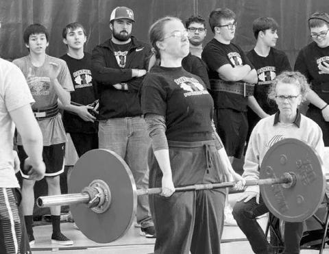 Maria Scherer completes one of her lifts at a powerlifting meet in Box Elder last week. Scherer took first place in her division.