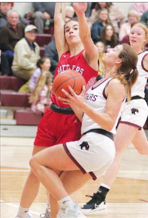 Timber Lake’s Shay Kraft drives for a lay-up against a Potter County defender during action earlier this month. Kraft leads an undefeated Lady Panther squad into the conference tournament beginning Thursday, Jan. 19. Photo by Jon Flatland