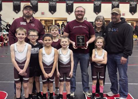 The Timber Lake Youth Wrestling Team was presented the Don Vorhees Sportsmanship Award at the Brandon Delzer Memorial Wrestling Tournament held Saturday, Jan. 11, in Sturgis. Team members are (l-r) Crawford Maher, Lincoln Aberle, Wilson Wiedmer, Vern Long (middle) Trevor Aberle and Rowan Maher; (back) Coaches Travis Spiel and Sawyer Sandquist along with members of the Vorhees family.