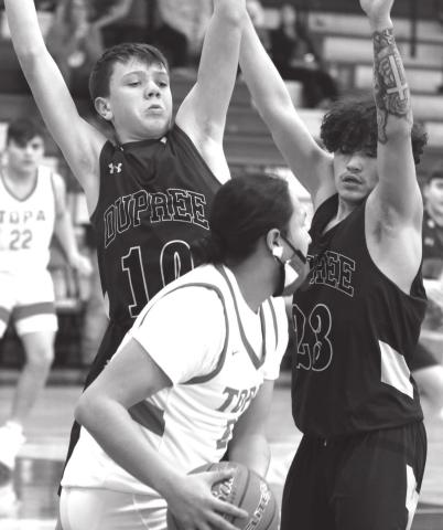 Dupree’s Klayte McLellan (10) and Ted Eagle (23) trap Tiospaye Topa’s Manuel Swan during their LMC tournament contest. Photos by Jon Flatland