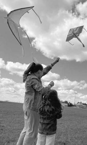 Go fly a kite ... Timber Lake Elementary School students took advantage of a warm sun and brisk breeze to fly kites at Doug Kraft Field last week.