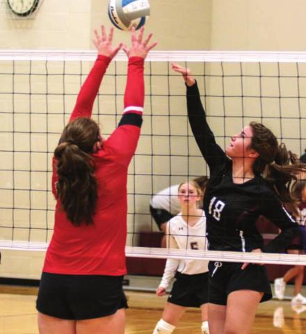 Timber Lake’s Natalie Gross (18), Sara Holzer (24) and Averie Marshall (5) in action versus the Bison Cardinals last week. Photo by Jon Flatland
