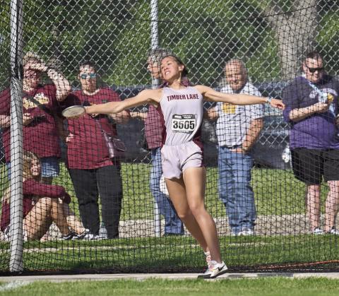 Timber Lake’s Jasmine Nash throws the discus at the South Dakota Class B Track Meet in Sioux Falls last week. Nash, a senior, broke her own school record in the shot put with a throw of 39-07.75 to finish second overall and placed third in the discus with a distance of 122 feet. Photo by Marie DuPreez