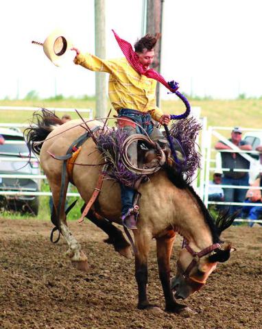 Cinch Hebb of Rapid City and formerly of Eagle Butte, waves his hat and lets out a shout during his first place-winning ride at the WSRRA Ranch Bronc shootout held Saturday in Eagle Butte as part of the community’s Hometown Days celebration. Photo by Jon Flatland