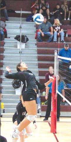 Timber Lake junior middle hitter Jasmine Nash goes up for one of the powerful kill spikes she is known for around the Little Moreau Conference during action at the LMC Volleyball Tournament held Saturday, Sept. 23, in Timber Lake. Photo by Jon Flatland