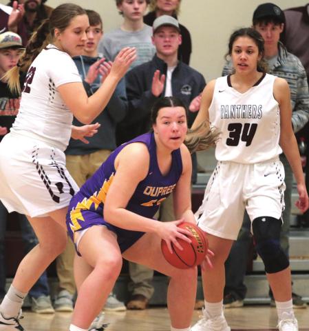 Rylin Rousseau (CENTER) of Dupree makes a post move against the defense of Timber Lake Panthers Tessa Goldade (LEFT) and Jasmine Nash (34). Photos by Jon Flatland
