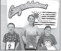 Greyson Goldade (left) received the Family and Consumer Science Award; Maya Biegler (middle) received the Club Secretary Award; and Stella Nilson (right) received the Club Reporter Award.