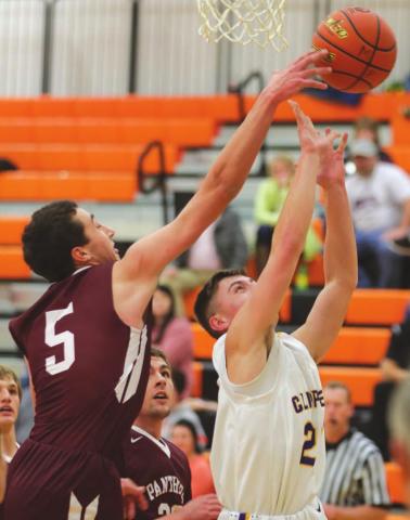 Timber Lake senior Trenton Hansen blocks the shot of an opposing player.