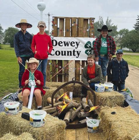 Top, the Western State Bank float in the Isabel Parade received the “Best of Show” award. Middle, members of American Legion Post 120 of Isabel destroyed damaged American flags in what became a very patriotic and emotional ceremony during the rodeo. Below, The Cordewzy 4-H Club won the award for “Best Youth Entry” in the Isabel Parade. Look for A LOT more photos on the Topic Facebook page! Photos by Jon Flatland and Denise Perryman
