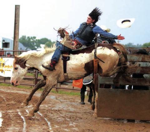 Jhett Knight of Dupree competes in bareback riding during the Dupree Pioneer Days Rodeo in June. Photo by Jon Flatland