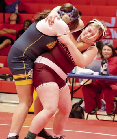 Timber Lake’s Lilly Veit begins a hip toss of her opponent Brealle Belt of Little Wound at the C-EB-Dupree Round Robin Tournament held Monday, Feb. 3, in Eagle Butte. Veit went on to pin Belt for the win. Photo by Jon Flatland