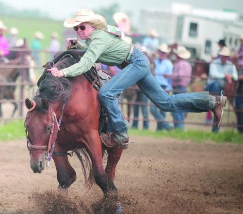 Talley Locken of Isabel was able to avoid a potentially serious spill when her horse bucked as Locken was dismounting during the goat-tying event at the Ziebach County 4-H Rodeo on Saturday, July 15, in Dupree. Photo by Jon Flatland