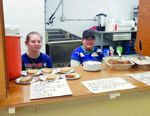 Tristan Swift and Gabe Bridges were selling concessions at the craft fair to raise funds for a Washington, DC trip being organized through the Timber Lake School.