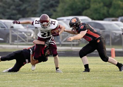 Panther wide receciver Eddie Keller (21) battles for yardage on a pitch-out during first half action of Timber Lake’s football season opener at Ipswich last Friday, Aug. 23. Timber Lake hosts Philip at Doug Kraft Field on Friday, Aug. 30, with kickoff set for 6 p.m. Photo by Jon Flatland