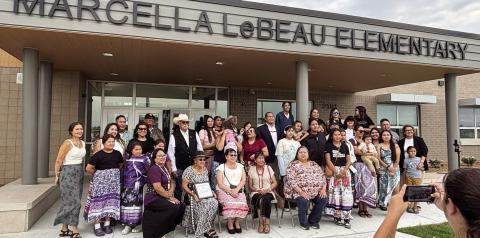 Members of Marcella LeBeau’s family gather for a photo under the front entrance to Marcellaa LeBeau Elementary School in Sioux Falls after a dedication and naming ceremony for the new school last week. LeBeau wss a respected elder and matriarch of the Cheyenne River Sioux Tribe. Submitted photo
