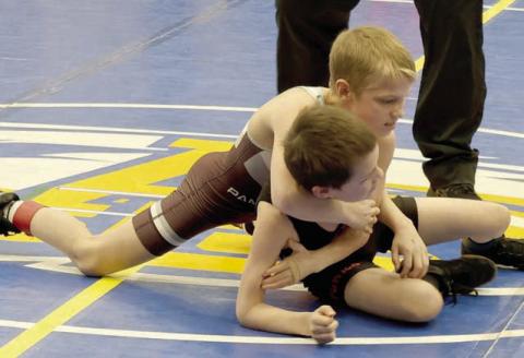 Barrett Hermes (top) works to get a hold on an opponent at the SDWCA Region 2 Youth Wrestling Tournament in Aberdeen on Sunday, March 15. Eighteen members of the Timber Lake Youth Wrestling Club advanced to compete in the State Tournament March 28-30 in Rapid City. Photo by Mikki Veit