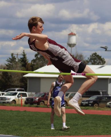Senior Kyler Bollinger clears the bar at 5-8, a personal best, to win the high jump crown at this year’s Little Moreau Conference Track Meet held last Thursday, May 9, at Kraft Field in Timber Lake.