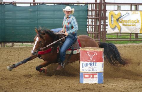 Hope Kiel of Glenham horse dips her horse around a barrel during the Senior Girls Barrels event at the 64th annual Ziebach County 4-H Rodeo in Dupree on Saturday, July 13. A second day of competition was cancelled due to storm damage at the Dupree Rodeo Grounds. Check out the Topic Facebook page for more Jr. and Sr. Girls Barrels and Poles photos. Photo by Jon Flatland