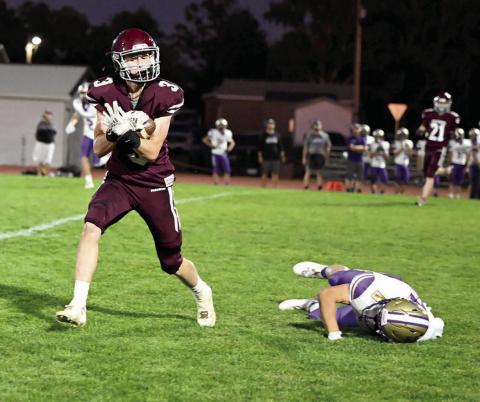Timber Lake wide receiver Holden Gill pulls in a pass behind a fallen Harding County-Bison defender that turned into an 80-yard catch-and-run touchdown during second quarter action at Doug Kraft Field last Friday, Sept. 27. Gill finished the game with three receptions for 104 yards and the TD. The Ranchers claimed a 44-12 win over the Panthers, who drop to 3-2 on the season. Timber Lake travels to Lemmon-McIntosh this Friday, Oct. 4. Photo by Marie Du Preez