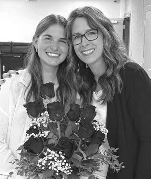 Meredith Maciejewski (left) was acknowledged with 13 roses for her 13 years in lessons. She has been taking lessons since she was in Kindergarten. She will have her Senior Recital June 1 at 2:00 in the school theater.