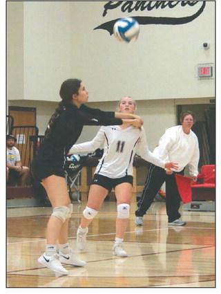 Natalie Lawrence hits a bump shot while teammate Averie Marshall (11) looks on during Lady Panther volleyball action against Dupree last Thursday, Sept. 14. Photo by Jon Flatland