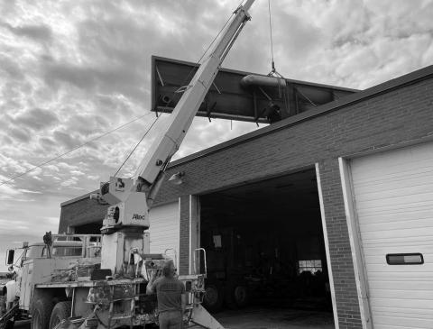 Perry Keller, Joe Martindale and Kyle Tesch of Keller Trenching, along with Albert Keller of Keller Drilling, removed the old solar panels from the roof of the Isabel City Shop last week as part of a re-roofing project. The flat roof is being replaced by a pitched roof.