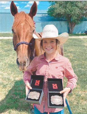 Korbi Heck of Isabel and her horse, Jetta, won both the Junior Girls Barrel Racing and Junior Girls Pole Bending championships on Saturday, July 8, at the Harding County 4-H Rodeo in Buffalo. Heck is one of several area competitors to garner gold buckles at the event.