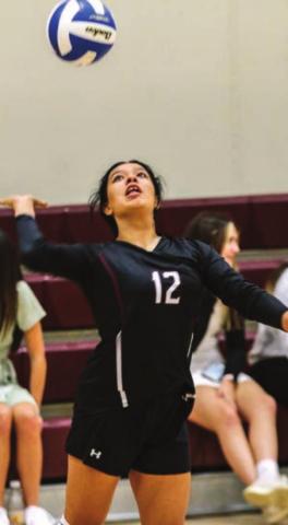 Kessa Bigger gets ready to send a serve over the net.