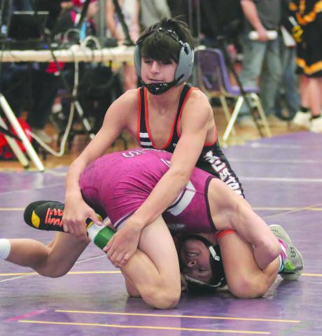 Ethan Ward (top) of McLaughlin-Timber Lake has Logan Pankratz of Marion-Freeman wrapped up in a tight little package during their match in the first-round of the 106-pound division at the Big Dakota Conference Wrestling Tournament in Ft. Pierre on Saturday, Feb. 4. Pankratz was able to turn the tables on Ward and pulled out a 6-4 decision for the win. Photo by Jon Flatland