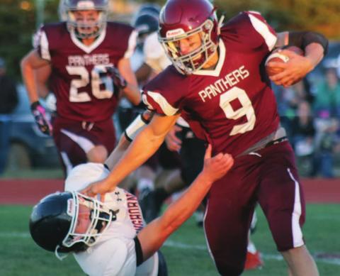 LEFT: Timber Lake running back Hank Kraft stiffarms a Faith Longhorn defender during a run on Friday night in the Panthers’ home opener. Kraft caught three touchdown passes and ran for another in the 64-14 victory.