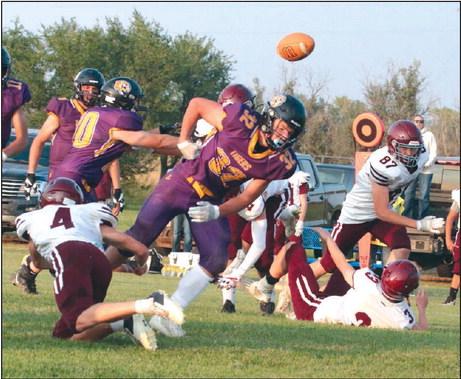 Dupree running back Braydon Terveen-Smith coughs up the football after taking a hard shot from Timber Lake defender Gracen Hansen (4) during the second quarter of the Tigers’ 26-6 upset over the Panthers last Friday, Sept. 9. Terveen-Smith was Dupree’s plow horse, finishing the contest with 110 yards and three TDs on 27 rushing attempts. Photos by Jon Flatland