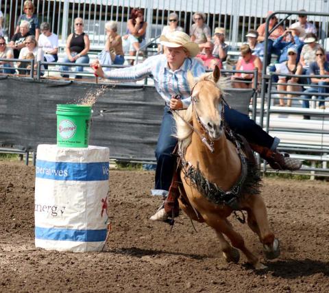 Victory Kosel of Glenham makes a successful pass during the Jr. Girls Flag Race at the SD State 4-H Finals Rodeo in Ft. Pierre on Saturday.