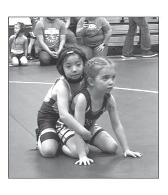 Ramzi Veit, left, was among the gold medal winners at the Mobridge Youth Wrestling Invitational held Sunday, Feb. 11. Ramzi took top honors in the Girls Tots 38-39 division. Eight member of the Timber Lake Youth Wrestling Club earned top spots on the winners podium. Courtesy Photo