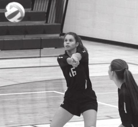 ABOVE: Timber Lake’s Manuela Molinera-Munoz bumps a serve back over the net.
